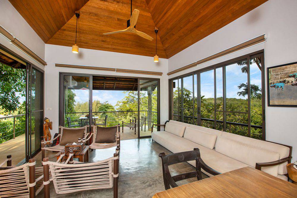 living room and kitchen with sea side view